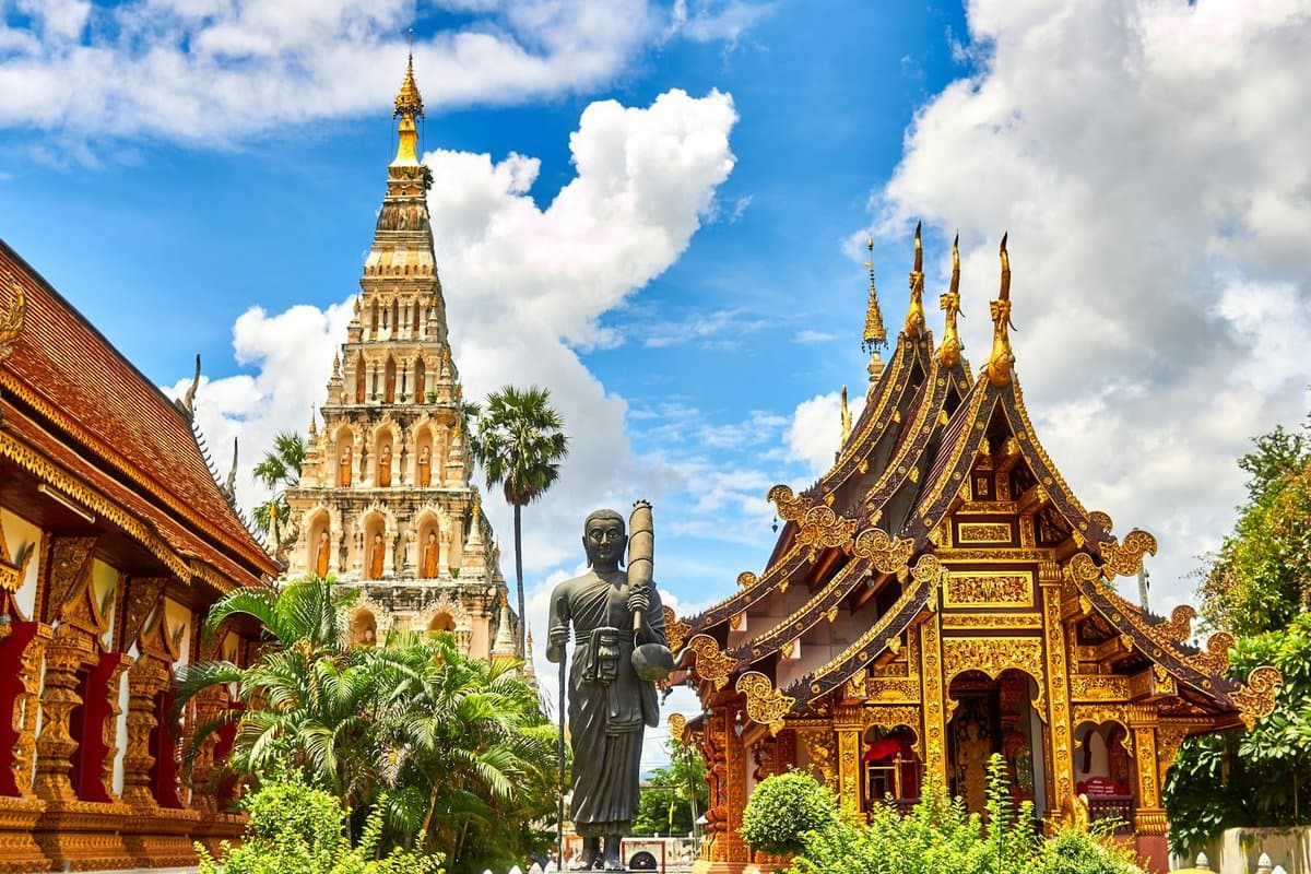 Ornate golden Buddhist stupa in Thailand travel scene